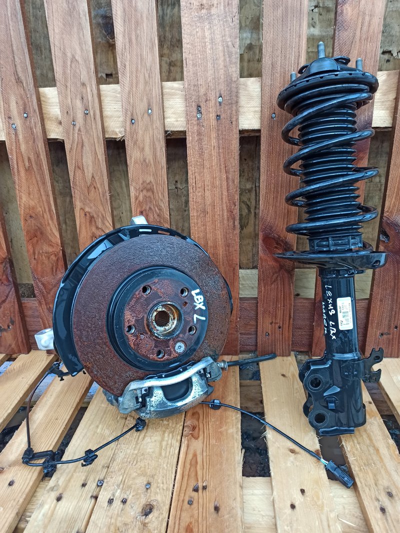 LEXUS LBX NOGA PIASTA AMORTYZATOR LEWA STRONA