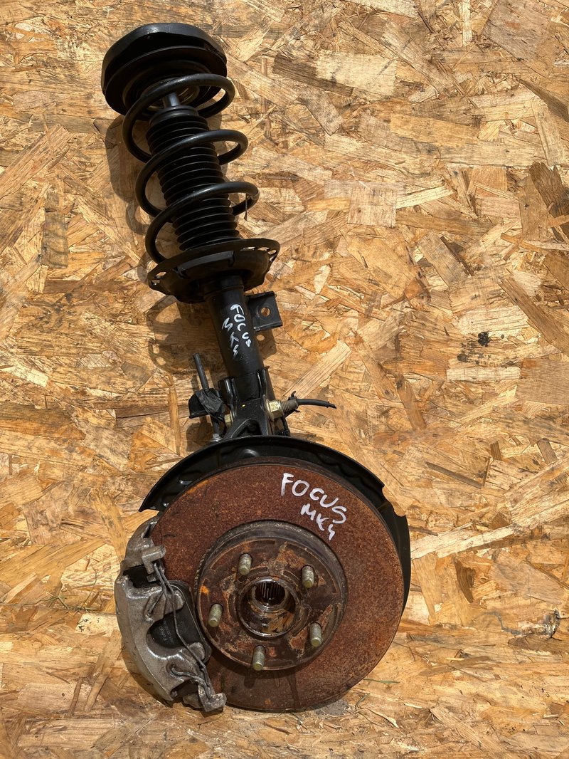 FORD FOCUS MK4 MCPHERSON ZWROTNICA AMORTYZATOR LEWY PRZÓD